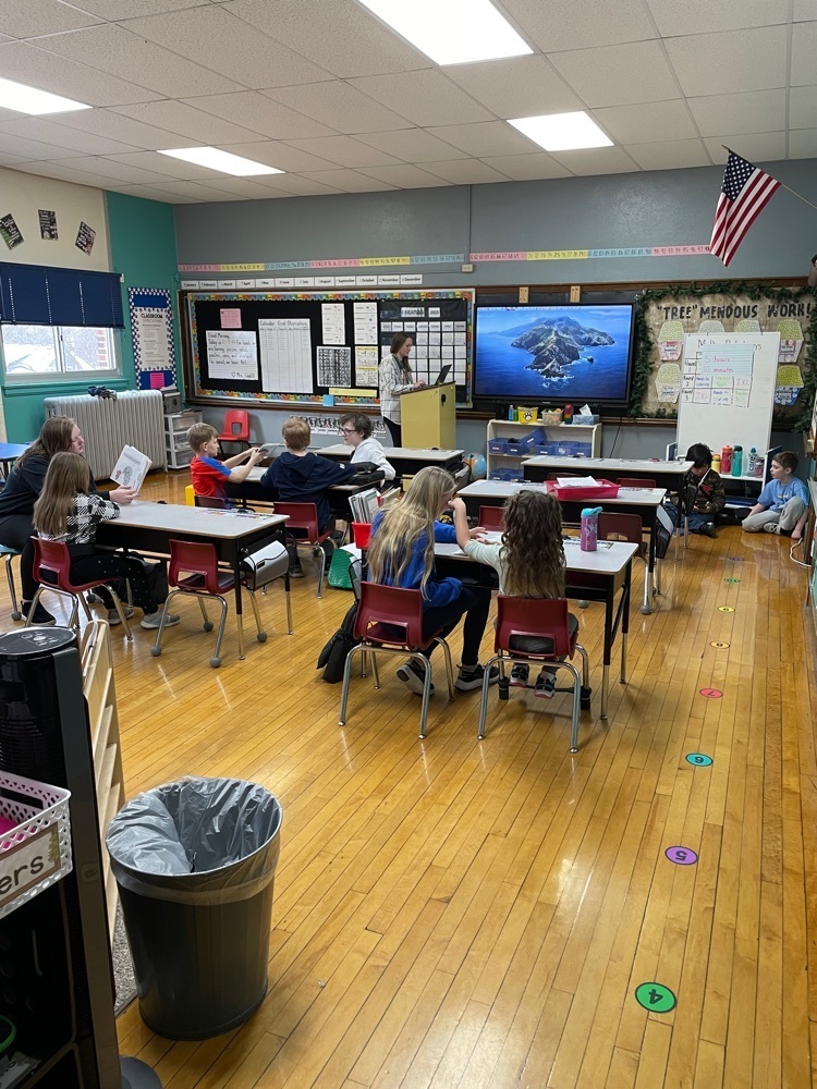 Here are the 7th graders reading to the 1st graders!